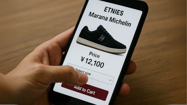 スマートフォンでETNIES Marana Michelinの購入画面を開き、「カートに追加」ボタンを押そうとしている手元の写真